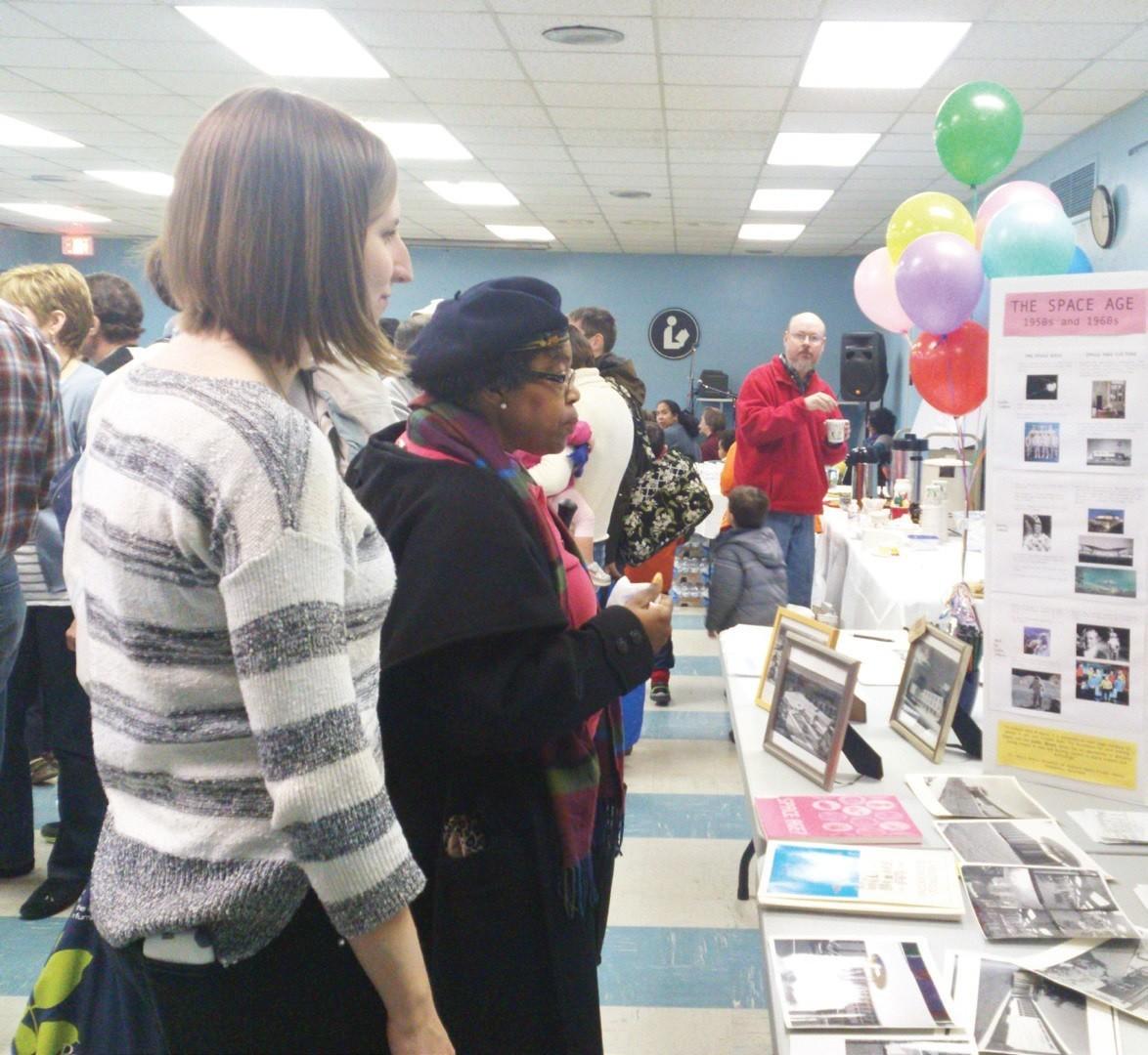 During the 50th-birthday bash for the Hyattsville library on March 2, visitors gathered in the ground-floor meeting room for a glimpse of the libraryʼs long and rich history. Courtesy Gray O'Dwyer