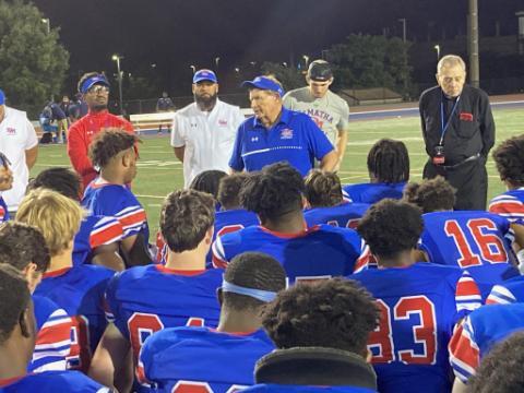 DeMatha Coach Bill McGregor addresses his team after its 34-0 victory over Friendship Collegiate Academy. It was McGregor's 297th career win, all with the Stags. Photo courtesy of Chris McManes