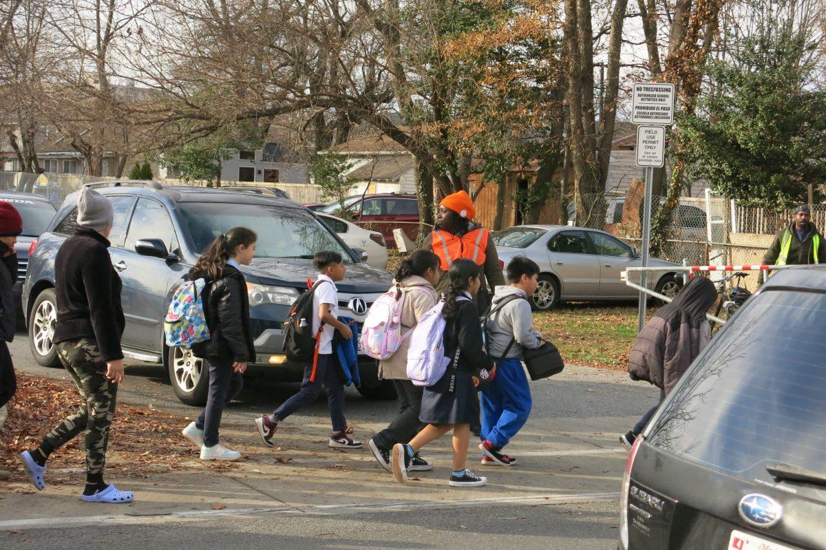 Staff directing traffic at a local school with no crossing guards.
Photo credit: Paul Ruffins
