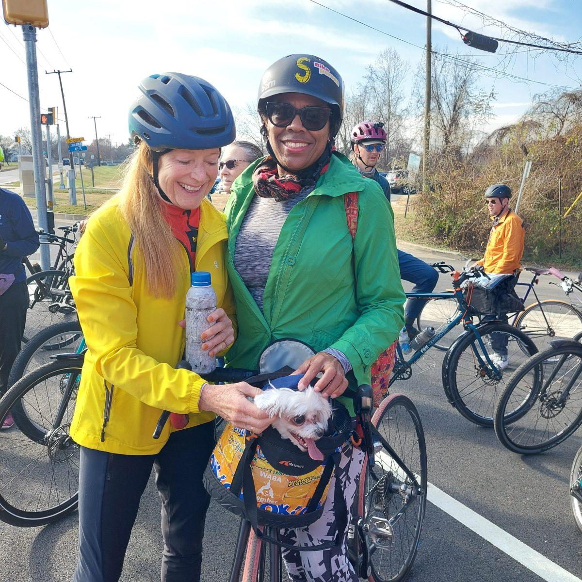 Lucy Bowen McCauley from Arlington, Va., (left) greets Sherri Joyner from West Hyattsville and gives her companion Leo a scratch before they set off for the Trolley Trail celebration bike ride.
Photo credit: Jessica Arends