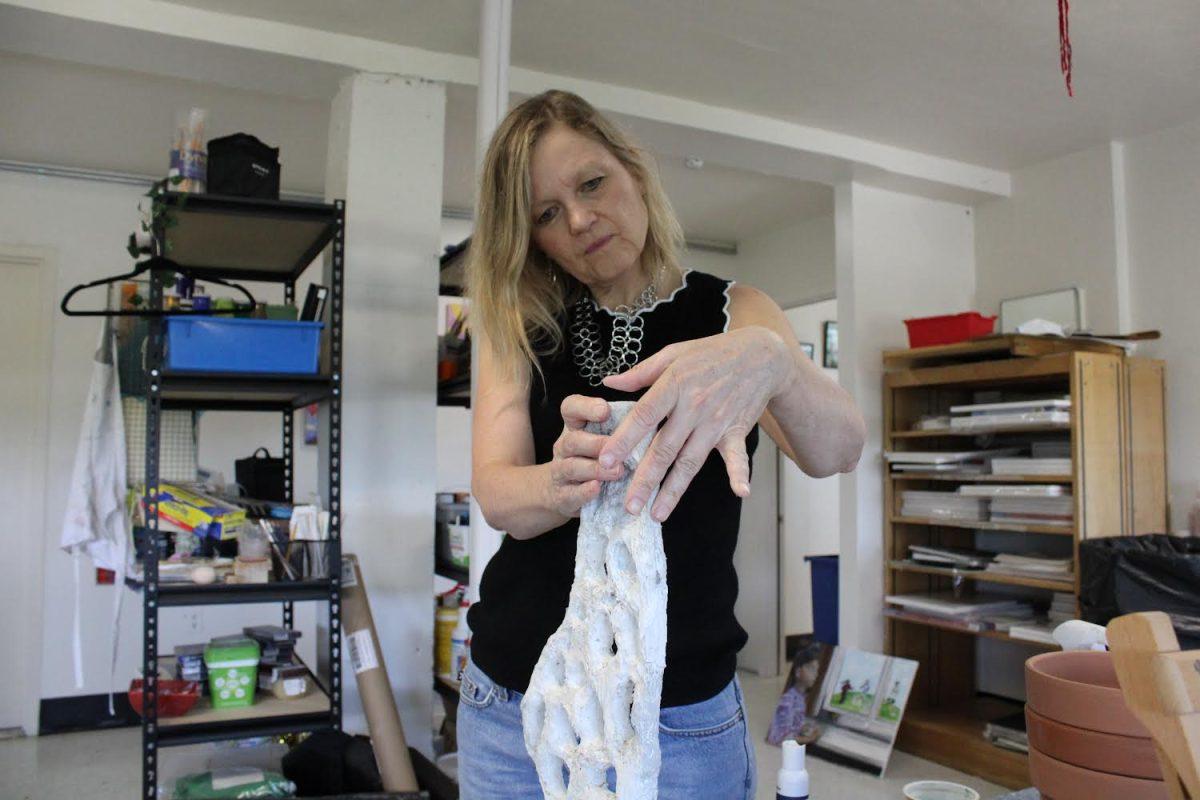 Christine Lee Tyler works on pieces for the sculpture garden in her classroom at St. Vincent Pallotti High School.
Courtesy of Aiesha Solomon
