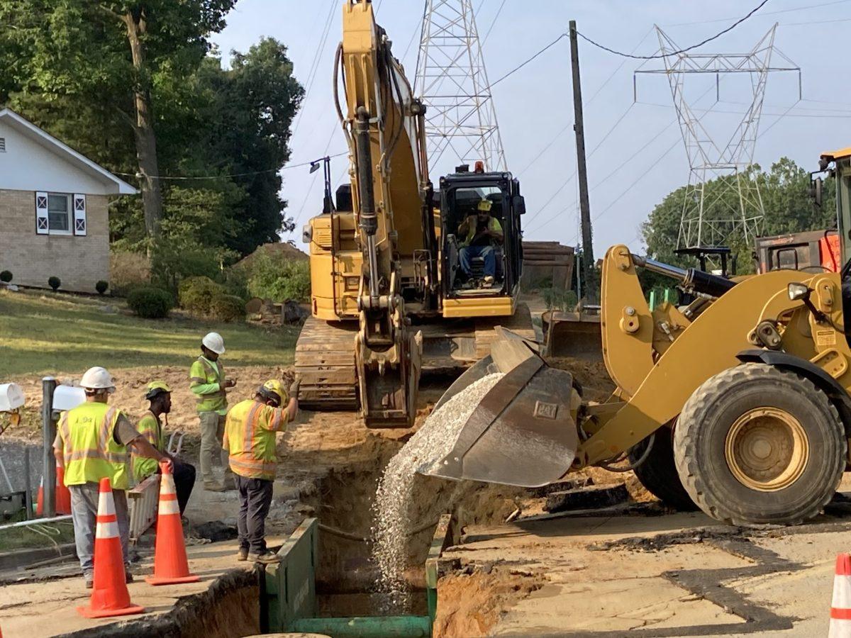 Workers with the Allan Myers construction company of Pennsylvania install one of the last sections of a water pipeline under Bond Mill Road last month.
Courtesy of Joe Murchison

