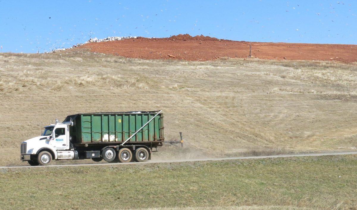 A large truck shows the scale of the landfill's mountain of trash.
Photo credit: Paul Ruffins