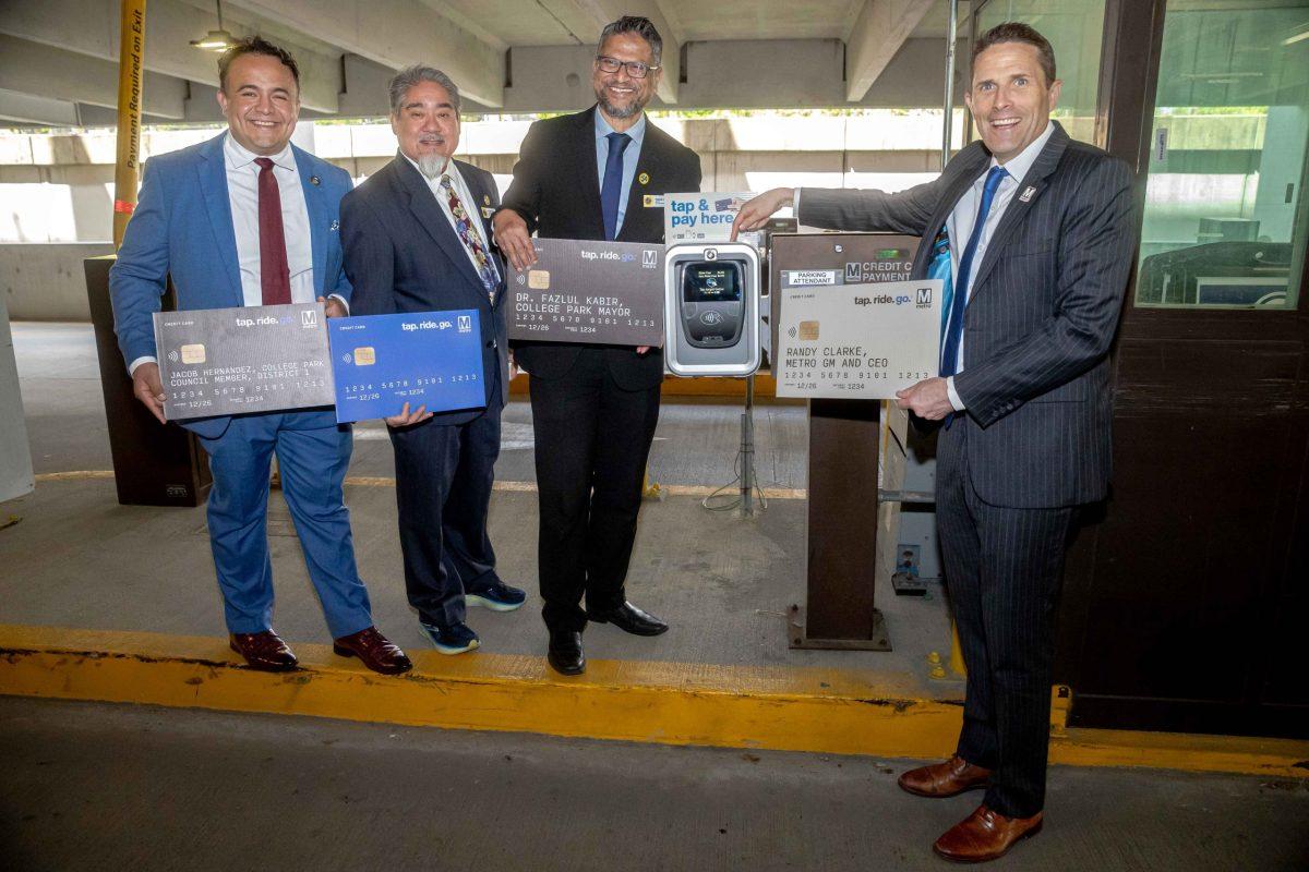 City officials attend a ceremony to help Metro announce that riders can tap their credit cards and mobile payment apps to pay for parking at the College Park-University of Maryland station. Shown, from left to right, District 1 City Councilmembers Jacob Hernandez and Alan Hew; Mayor Fazlul Kabir; and Metro CEO Randy Clarke. Photo courtesy of Washington Metropolitan Area Transit Authority