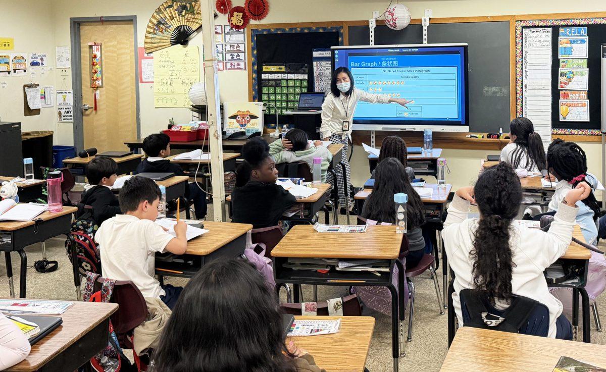 Third-grade teacher Peichen Chang teaches a class in Mandarin at Paint Branch Elementary School. Photo by JALEN WADE
